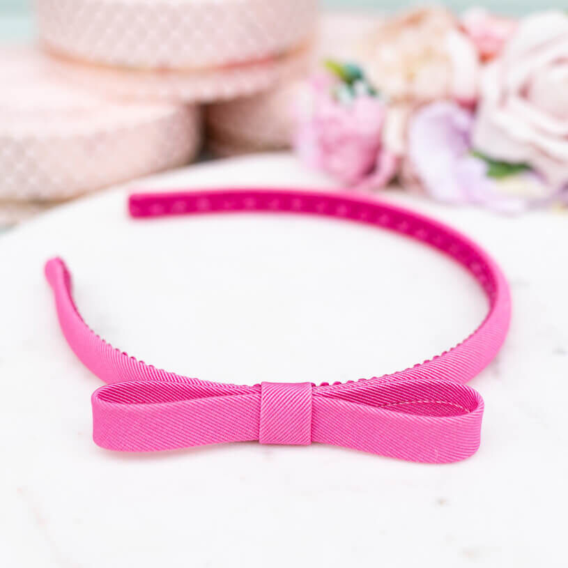 Schmaler pinker Satin-Haarreif mit Schleife